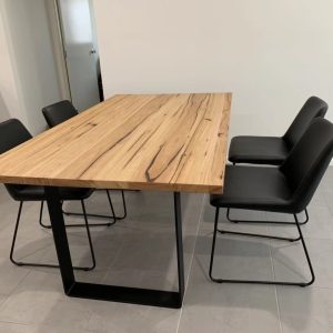 Wormy Chestnut Dining Table with Black Powder Coated Steel Leg